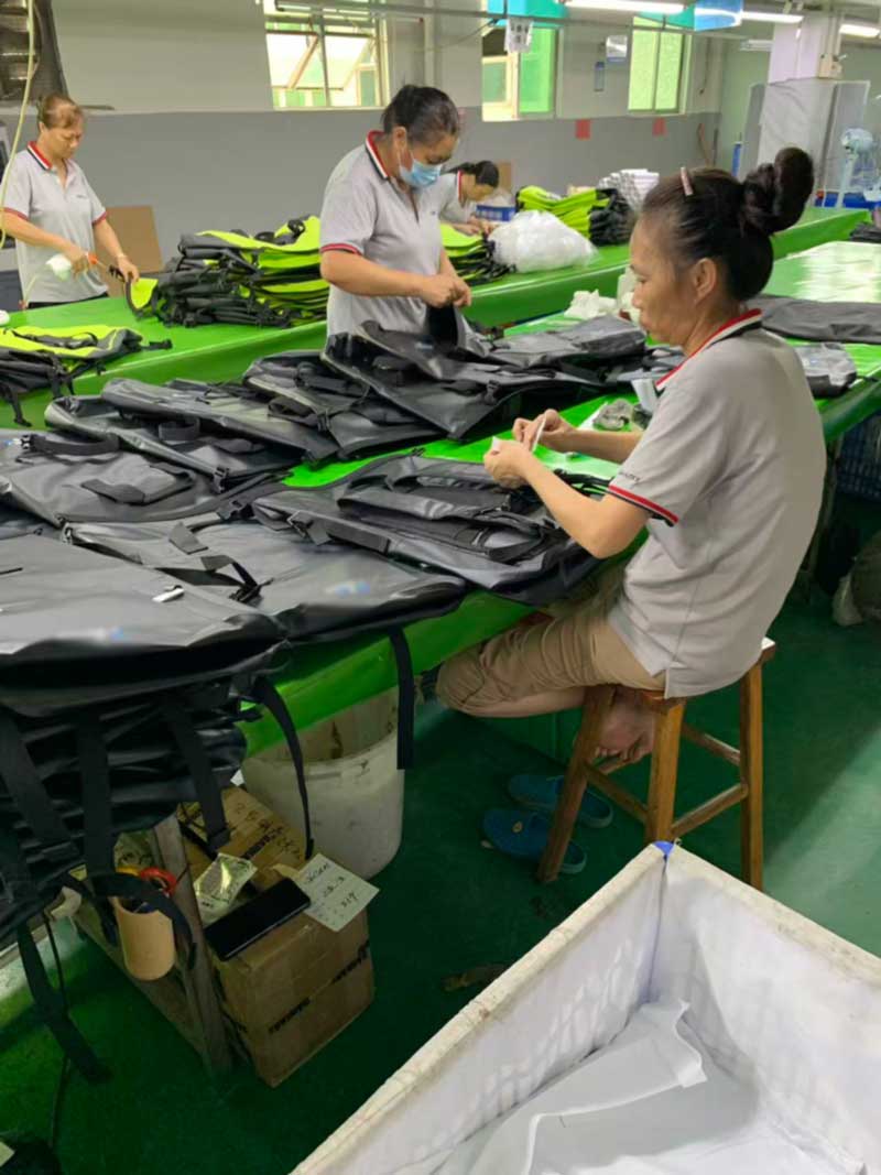 Finishing bench with tagged bags, cleaning cloths and packing materials